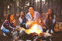 A family sitting around a campfire